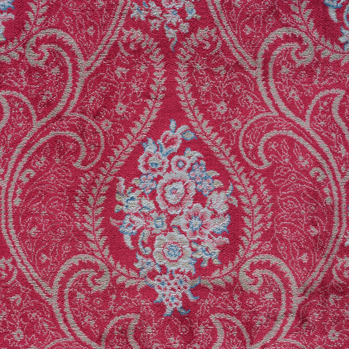 Close-up of red and blue paisley pattern fabric
